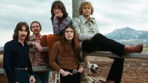 25 Mar 1973, Boulder, Colorado, USA --- Portrait of country rock band Poco on a pasture fence in Boulder for the cover of an album. --- Image by © Henry Diltz/CORBIS